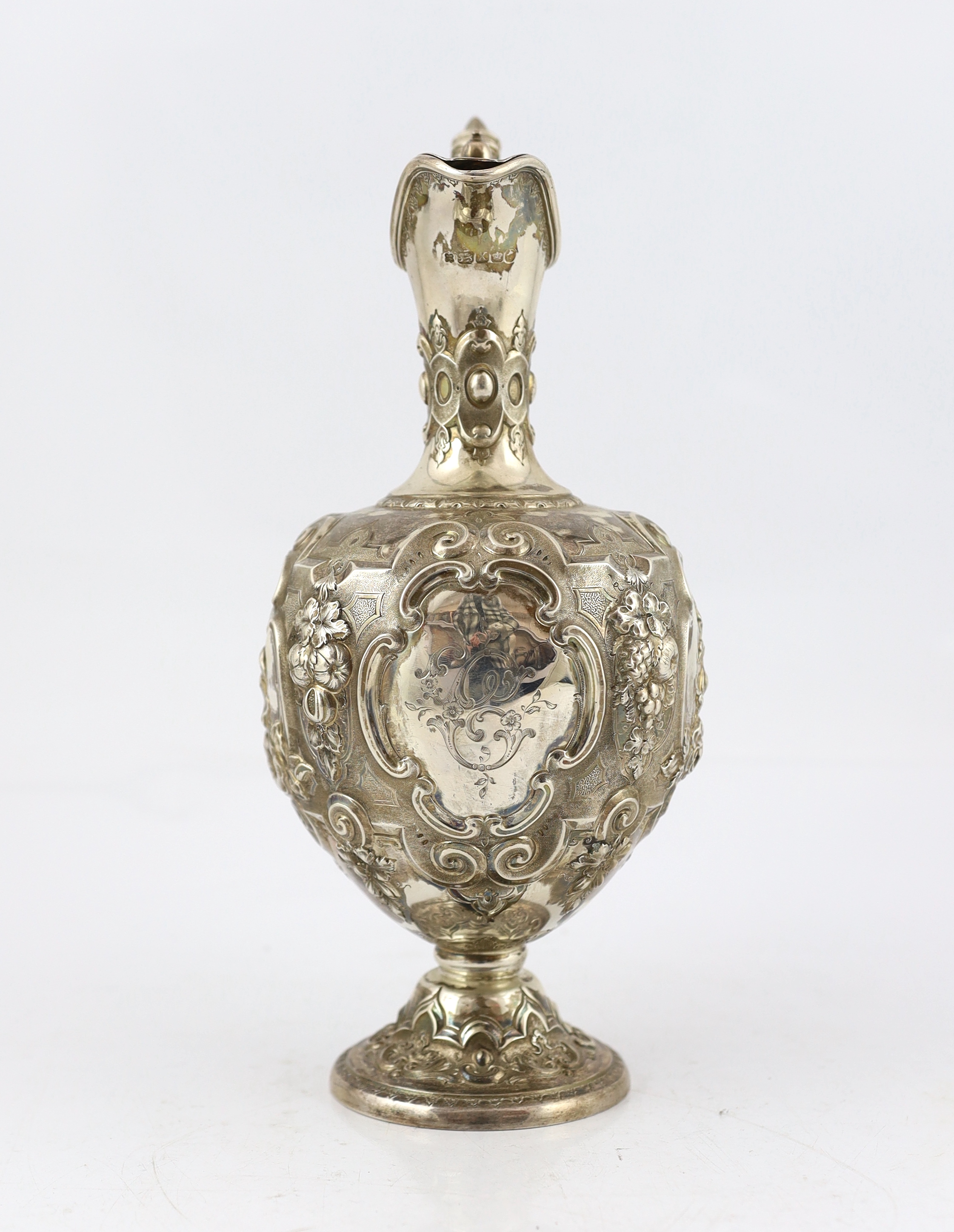 A Victorian embossed silver pyriform hot water ewer, by Martin, Hall & Co, CITES Submission reference V7KAR72D